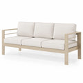 Kremowa sofa aluminiowa z poduszkami